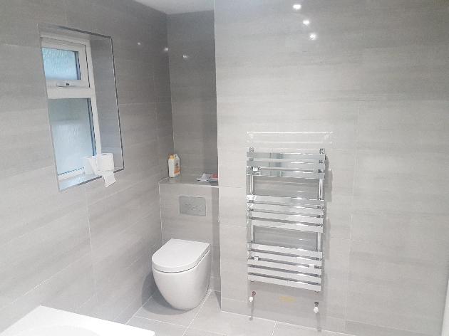 Concealed cistern loo and chrome towel rail